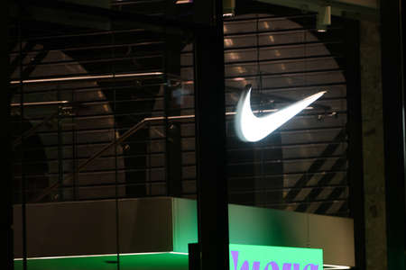 Milan, Italy - September 24, 2021: Nike logo displayed on a facade of a store in Milan.
