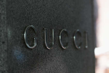 Milan, Italy - September 24, 2021: Gucci logo displayed on a facade of a store in Milan.のeditorial素材