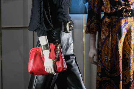 Milan, Italy - September 24, 2021: Mannequins standing in a window display of a clothing store.のeditorial素材