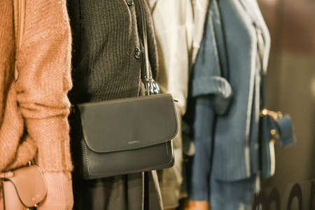 Milan, Italy - September 24, 2021: Mannequins standing in a window display of a clothing store.のeditorial素材