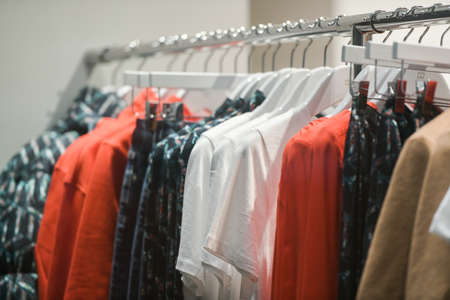 Milan, Italy - September 24, 2021: Women clothes on racks in a boutique store.のeditorial素材