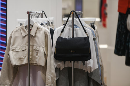 Milan, Italy - September 24, 2021: Women clothes on racks in a boutique store.のeditorial素材