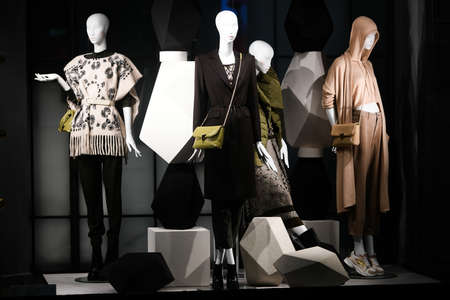 Milan, Italy - September 24, 2021: Mannequins standing in a window display of a clothing store.のeditorial素材