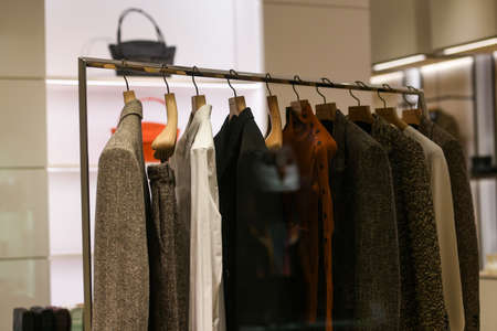 Milan, Italy - September 24, 2021: Women clothes on racks in a boutique store.のeditorial素材