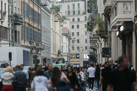Milan, Italy - September 24, 2021: People walking in busy downtown city center of Milan.のeditorial素材