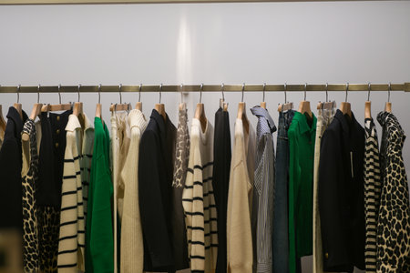 Milan, Italy - September 24, 2021: Women clothes on racks in a boutique store.のeditorial素材