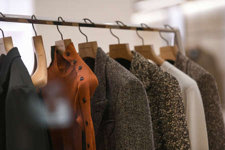 Milan, Italy - September 24, 2021: Women clothes on racks in a boutique store.のeditorial素材