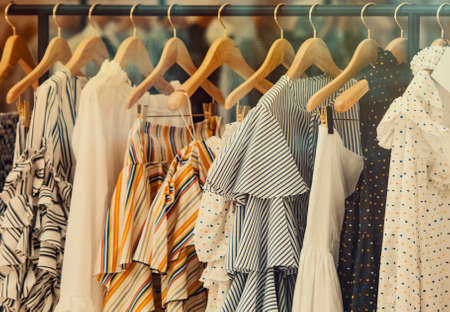 shopping concept - colorful clothing in a fancy storeの写真素材