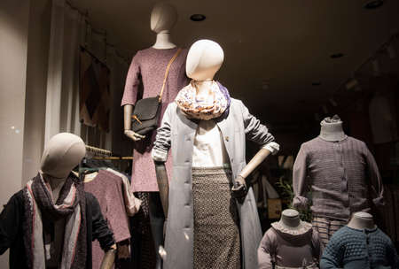 shopping concept - colorful clothing in a fancy storeの写真素材