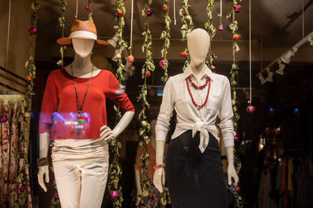shopping concept - colorful clothing in a fancy storeの写真素材