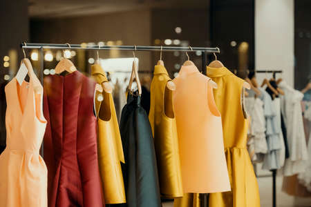 shopping concept - colorful clothing in a fancy storeの写真素材