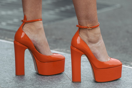 street style detail - woman wearing orange shoesのeditorial素材