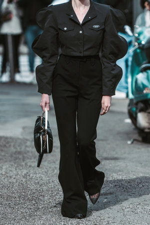 Milan, Italy - February, 24: Street style, woman wearing elegant black outfit.のeditorial素材