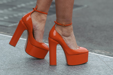 street style detail - woman wearing orange shoesのeditorial素材