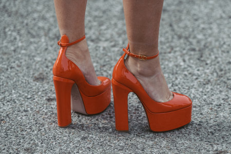 street style detail - woman wearing orange shoesのeditorial素材