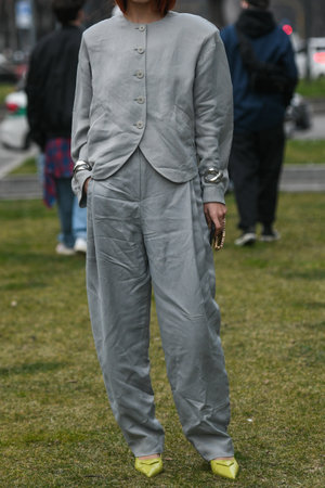 Milan, Italy - February 25, 2022: Street style, woman wearing fashionable outfit.のeditorial素材