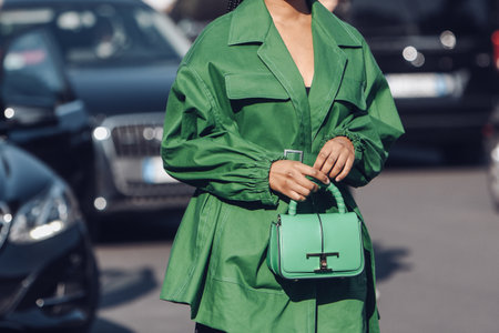 Milan, Italy - February 25, 2022: Street style, woman wearing fashionable outfit.のeditorial素材