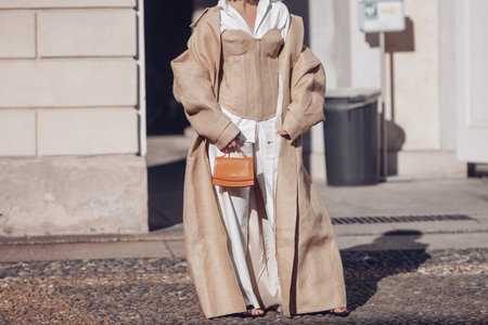 Milan, Italy - February 25, 2022: Street style, woman wearing fashionable outfit.のeditorial素材