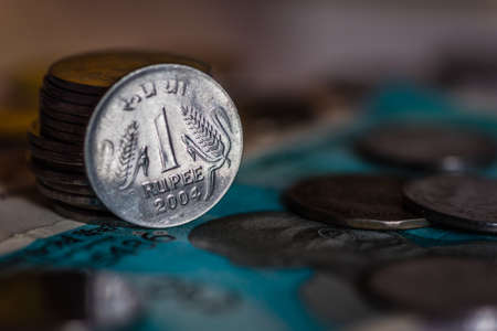Indian currency coines of Rs. One isolated on currency noteの写真素材