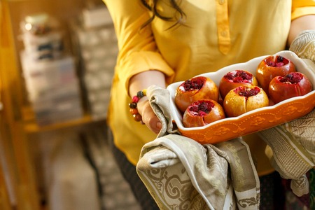 dish with apple dessert in female handsの写真素材