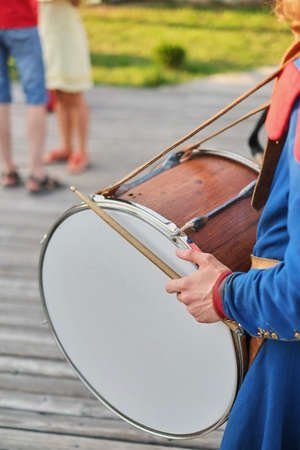 hands with drum sticks and a big drum National dressの写真素材