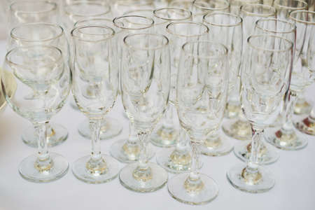 empty glasses buffet table glass white table tableclothの写真素材