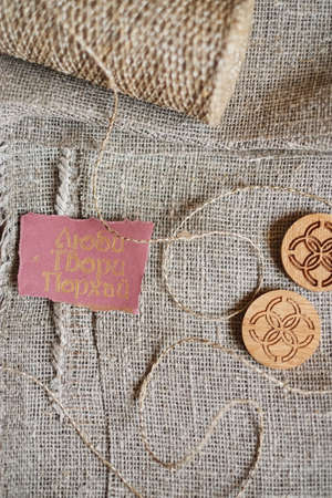 texture of weaving rough white color for abstract backgrounds with wooden round symbols and a love card, create, flyの写真素材