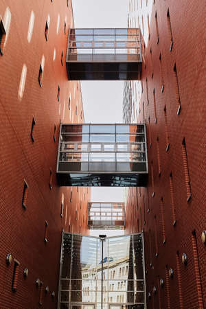 Sky bridge between two commercial high rise building in downtown city core Red brick