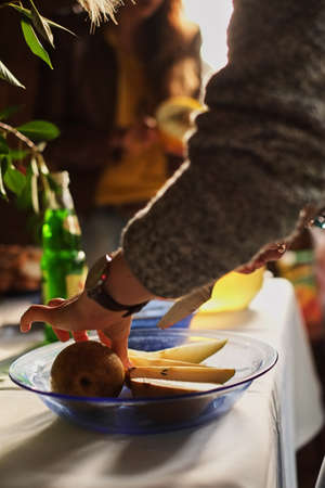 woman cooking with pear at home kitchenの写真素材