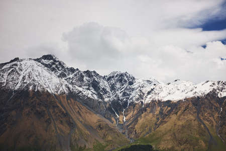Landscape of a valley of a mountain valley, mountains with snow-capped peaks, mountain peaks, Georgia, Caucasusの写真素材