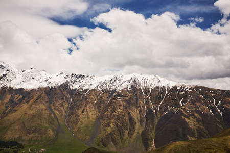 Landscape of a valley of a mountain valley, mountains with snow-capped peaks, mountain peaks, Georgia, Caucasusの写真素材