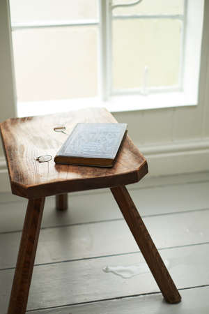 an old book is on the chair