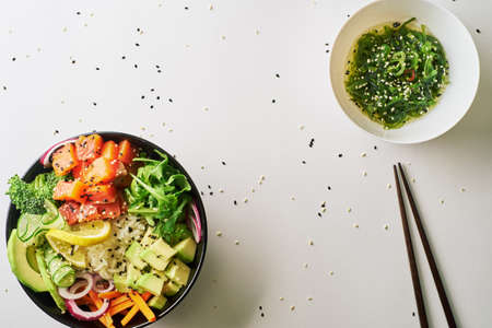 poke bowl with salmon islated on white background. top viewの写真素材