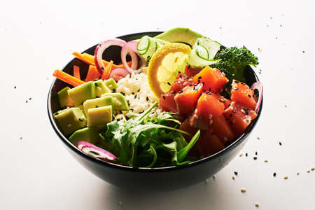 poke bowl with salmon islated on white background. side viewの写真素材