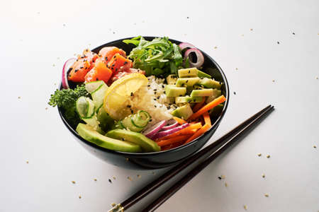 poke bowl with salmon islated on white background. side viewの写真素材
