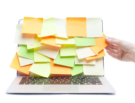 Laptop covered with stickers, isolated on white