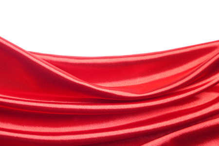 Abstract red silk fabric over white backgroundの写真素材