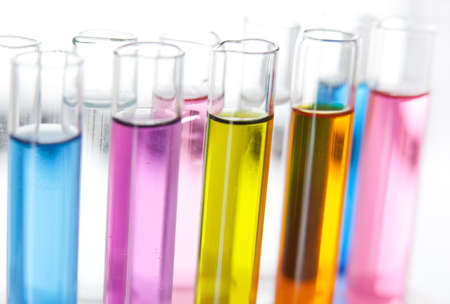 Set of test tubes with a colored liquids in a rack, close-up view Set of test tubes with a colored liquids in a rack, close-up view
