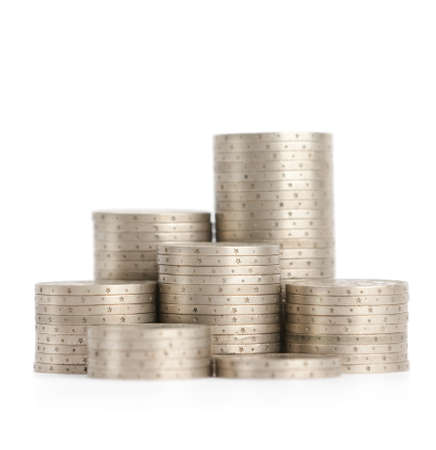 Silver coins stand vertically in low columns, isolated on white  Symmetrically posed coins symbolise...