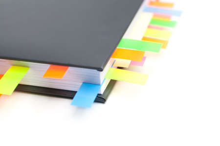 Business diary with a tabs, isolated on white backgroundの写真素材