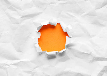 Circle shape breakthrough paper hole with white backgroundの写真素材