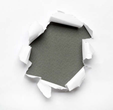 Grey circle shape breakthrough paper hole with white background Grey circle shape breakthrough paper hole with white background