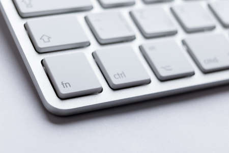Part angle of light keyboard of the laptop, isolated on white