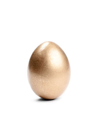 Golden Easter egg, isolated on whiteの写真素材