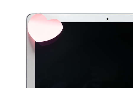 Laptop with a sticker in the shape of a heart