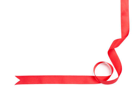 Shiny red ribbon for gift wrapping, isolated on white. Symbol of feast and happy holidayの写真素材