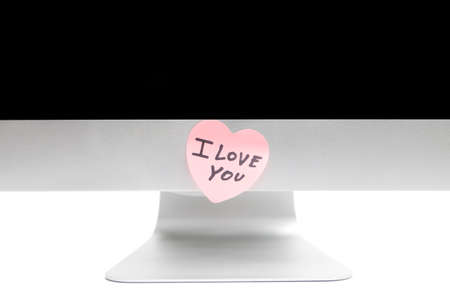 PC with a sticker in the shape of a heartの写真素材