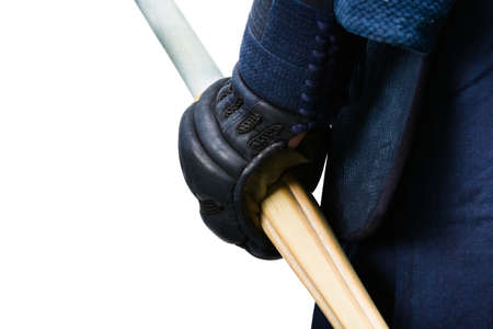 Close up of hand in kote with bokuto, isolated on white. Japanese martial art of sword fightingの写真素材
