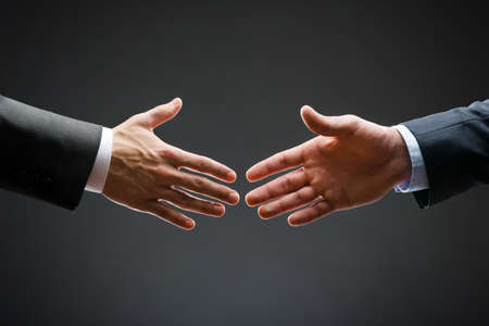 Close up of forthcoming handshake of business people  Concept of trustworthy relations and business cooperationの写真素材