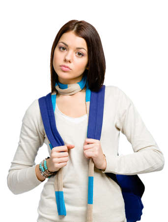 Half-length portrait of teenager wearing blue rucksack and colored scarf, isolated on white